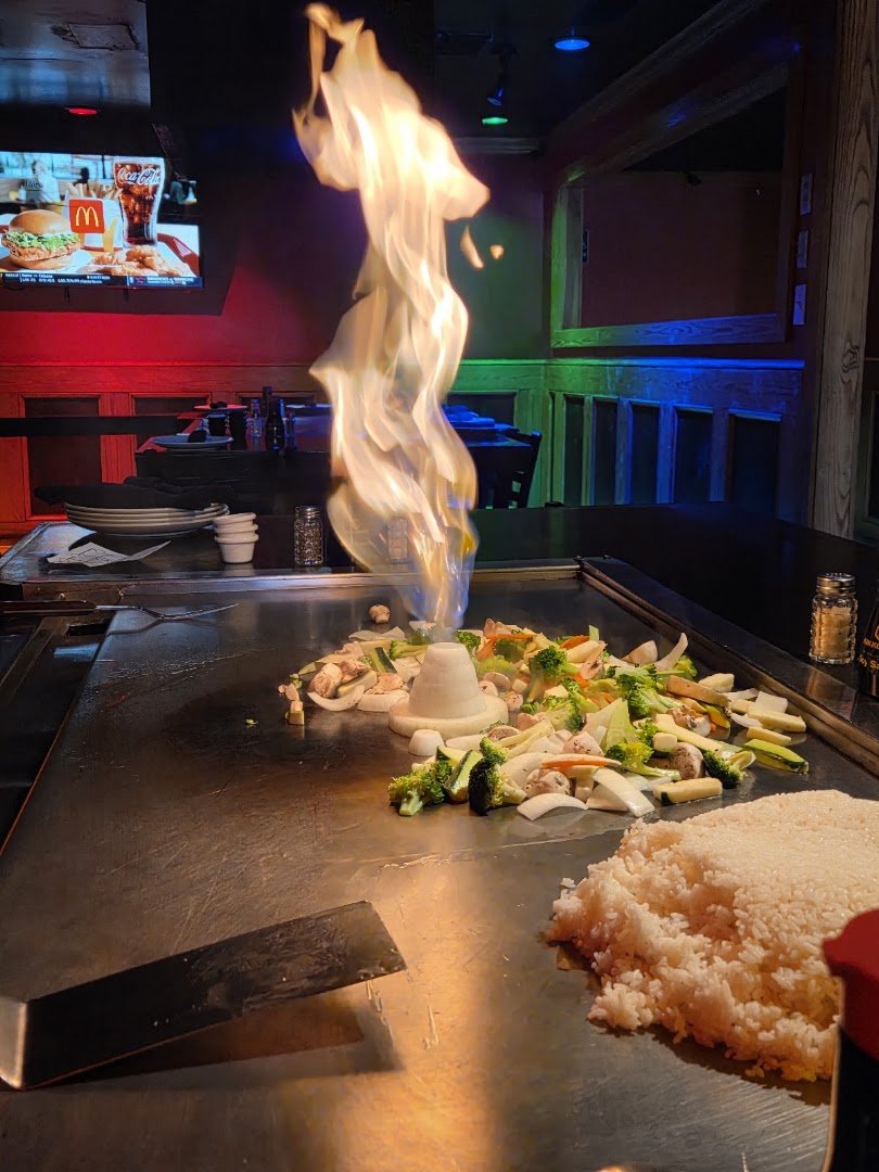 Sushi counter beside the grill area.