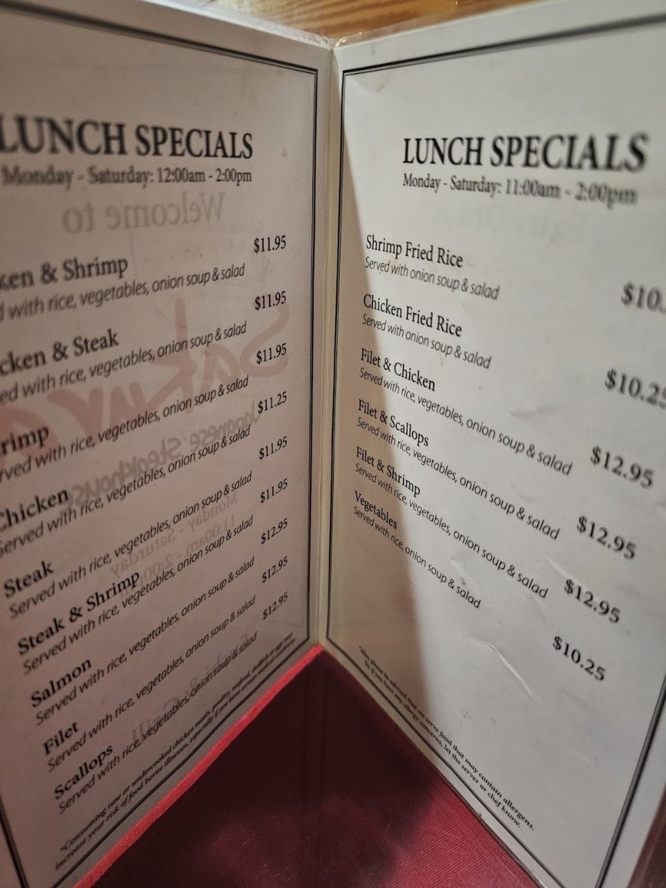 Menu spread showing sushi and grilled dishes.